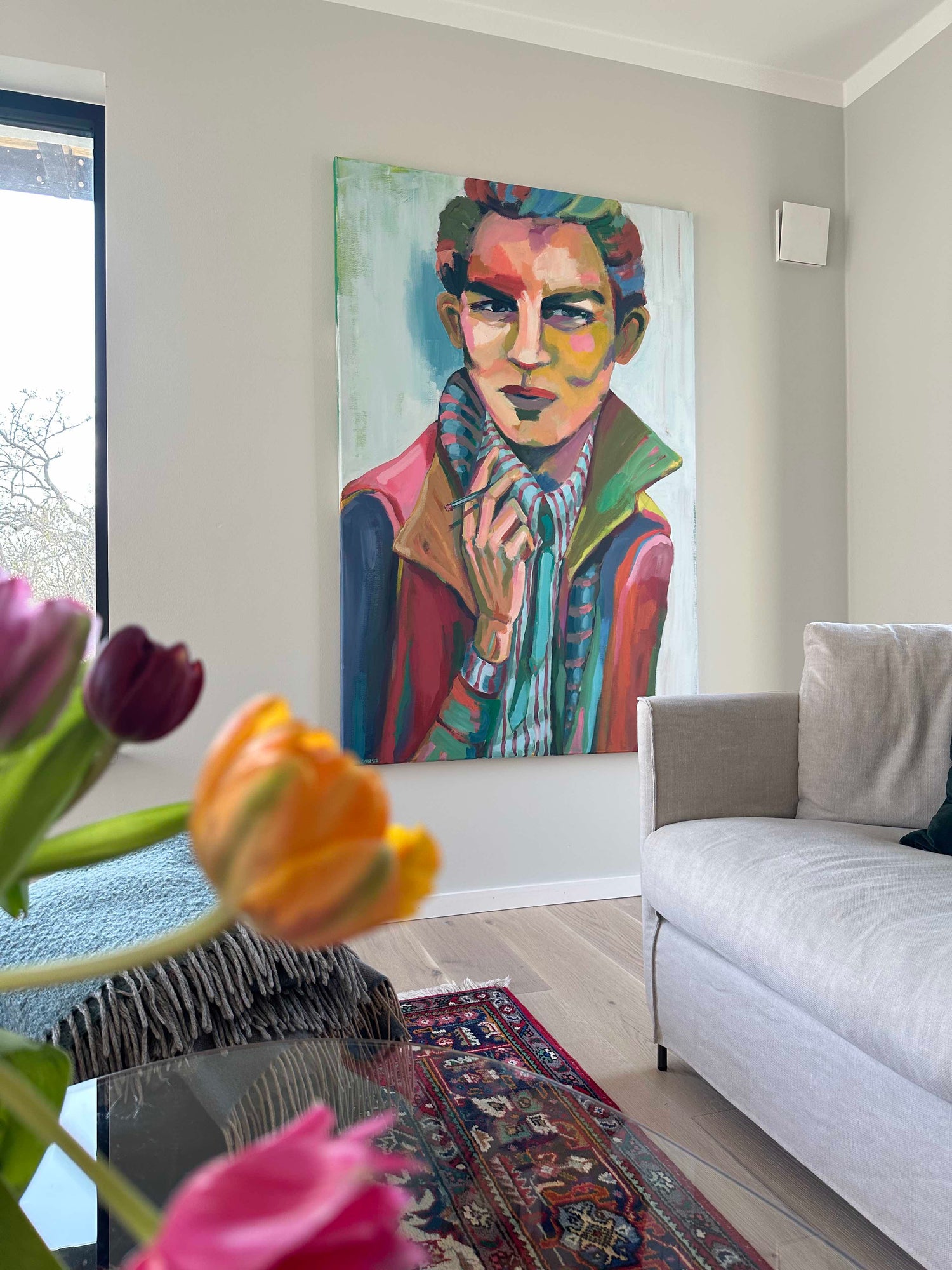 Expressive layered portrait titled Ralph featuring bold colour contrasts, raw emotion, and textured brushstrokes in a bohemian home.